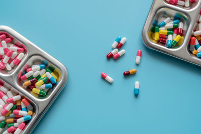 High angle view of medicines on blue background