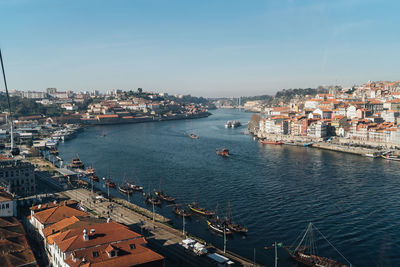 High angle view of buildings by sea against sky