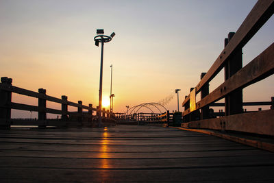 Low angle view of bridge against sky during sunset