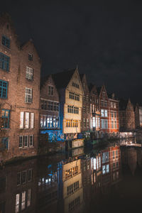 Illuminated buildings in city at night