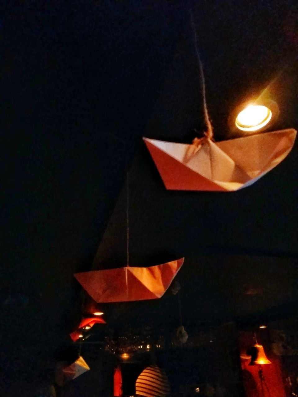 ILLUMINATED LAMP AGAINST STAR SHAPE LIGHTS