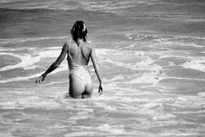 Rear view of woman on beach