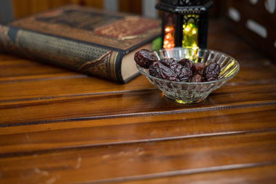 Close-up of coffee beans in glass on table