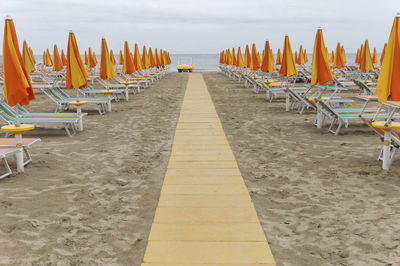 Lounge chairs and parasols on beach