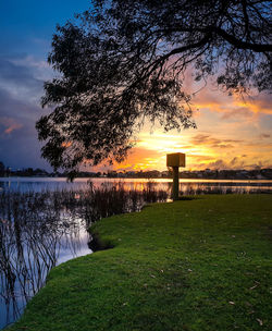 Scenic view of lake against sky during sunset