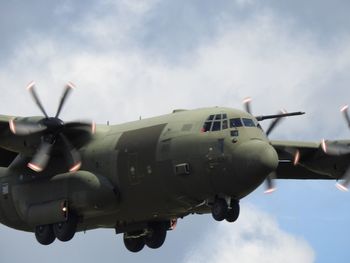 Low angle view of airplane against sky