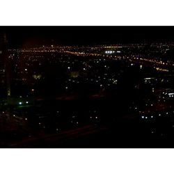 Illuminated cityscape at night