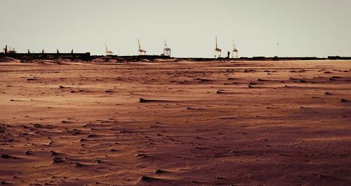 Scenic view of desert against clear sky