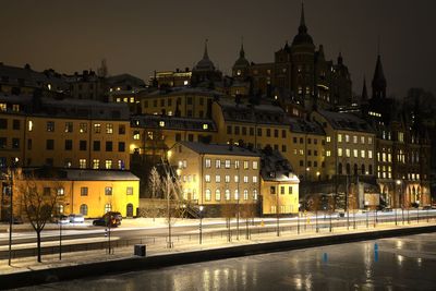 Buildings in city at night