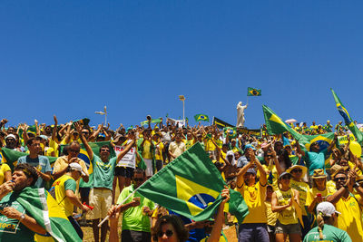 View of people against clear blue sky