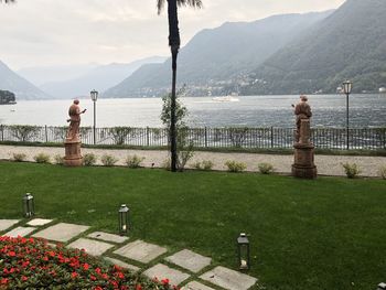 Scenic view of lake and mountains against sky