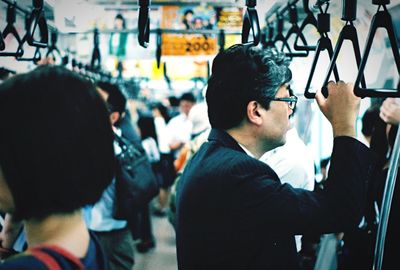 Close-up of men in city
