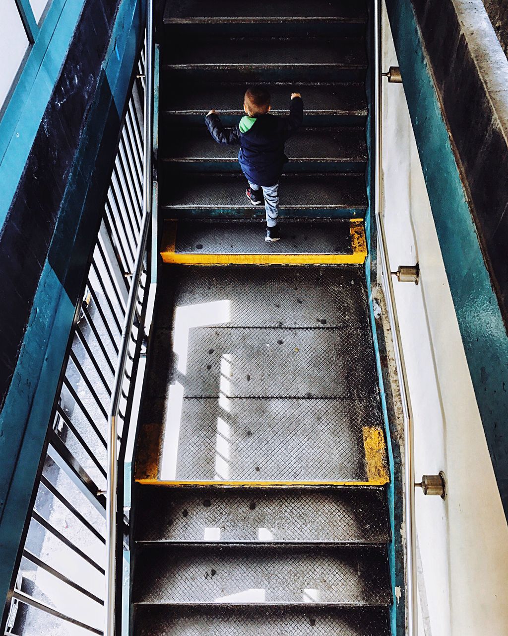 high angle view, steps and staircases, railing, steps, staircase, men, indoors, day, people