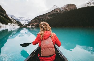 Rear view of woman in lake