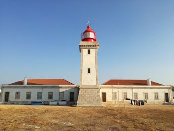 Lighthouse against clear blue sky