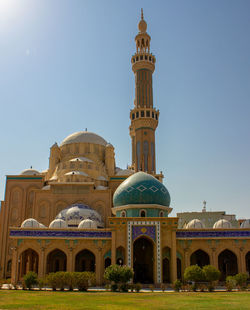 Mosque with bushes in front 