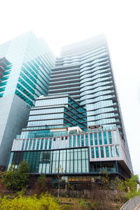 Low angle view of modern buildings against sky