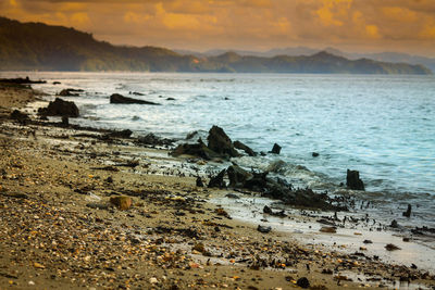 Scenic view of sea against sky at sunset