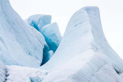 Close-up of snow against sky