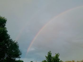 Low angle view of rainbow against sky