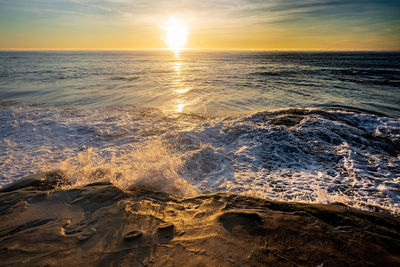 Scenic view of sea against sky during sunset