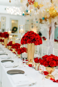 Red flower vase on table