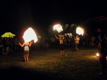 View of illuminated people at night