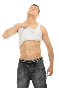 Young man looking away against white background