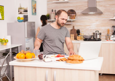 Man preparing food on table at home