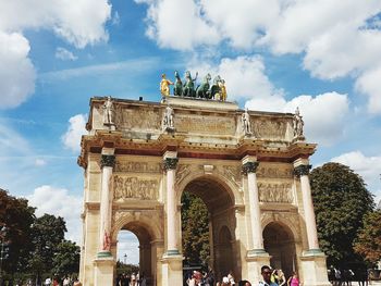 Low angle view of triumphal arch against sky