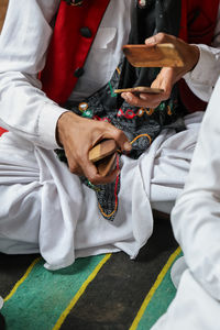 Traditional rajasthani musical instrument in hand at day