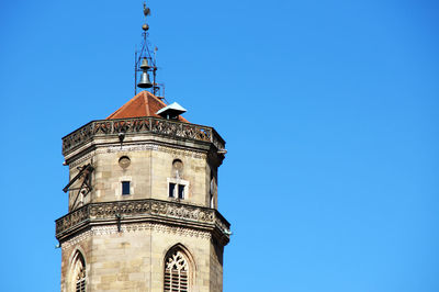 Low angle view of bell tower against clear blue sky