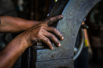 Close-up of man working in workshop