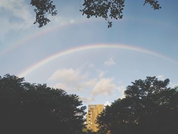 Low angle view of rainbow against sky