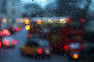 Raindrops on glass window in rainy season