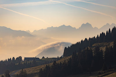 Panoramic view of silhouette mountains against sky during sunset