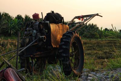 Tractor on field against sky