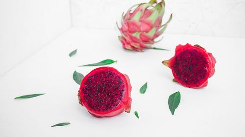 High angle view of strawberries on table against white background