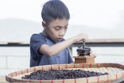 Boy holding table