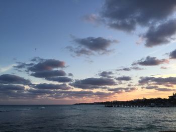 Scenic view of sea against sky at sunset