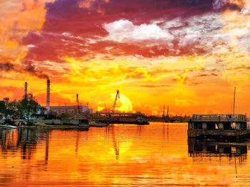 View of harbor at sunset