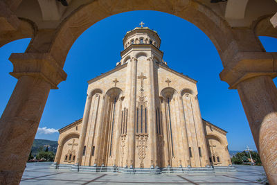 Low angle view of historical church against clear blue sky