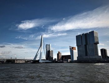 View of bridge and buildings against sky