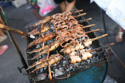 High angle view of meat on barbecue grill