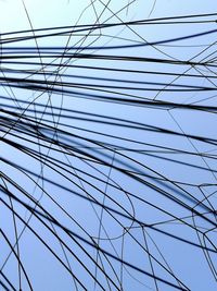 Low angle view of electricity pylon against sky