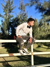 Side view of young man exercising on steps