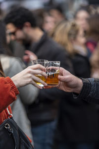 Midsection of woman holding drink