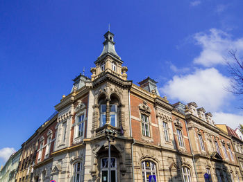 Low angle view of building against blue sky