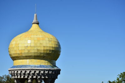 Low angle view of building against clear blue sky