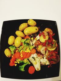 High angle view of fruits in plate on table